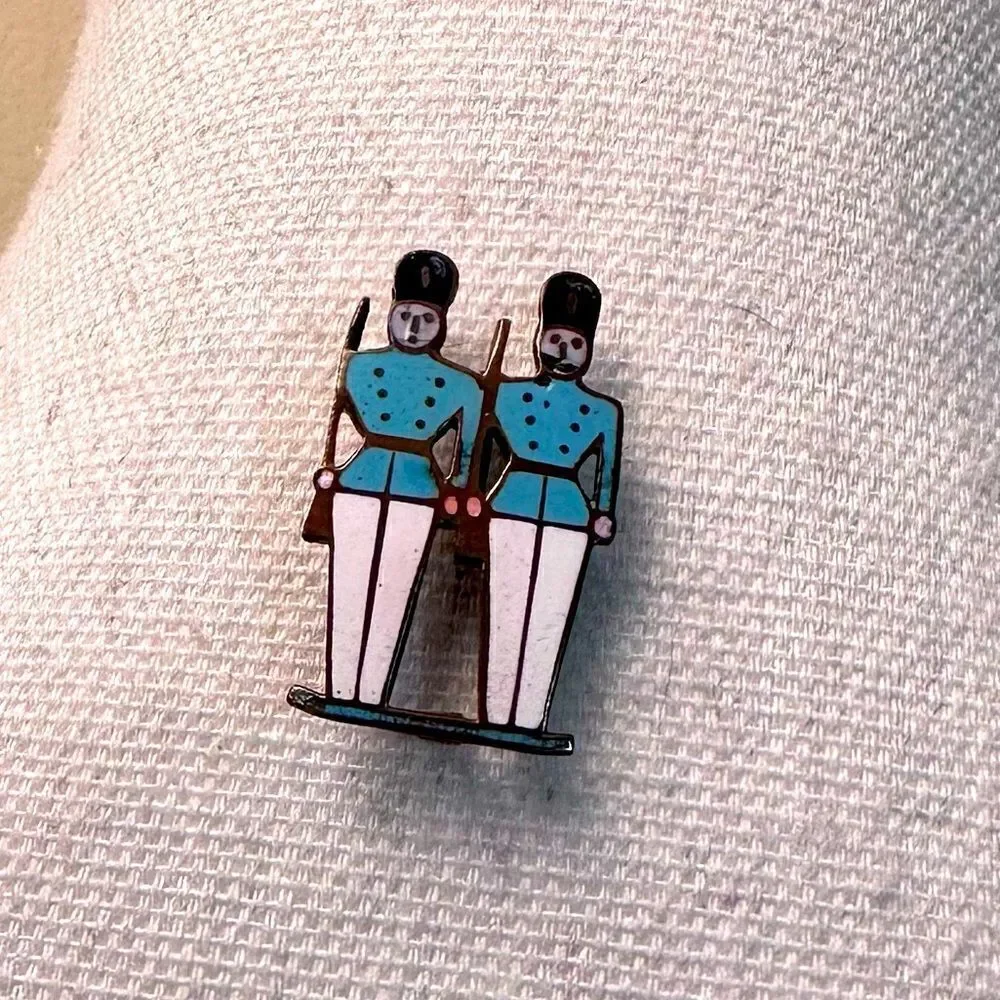 Vintage enamel on gold tone metal soldiers pin brooch